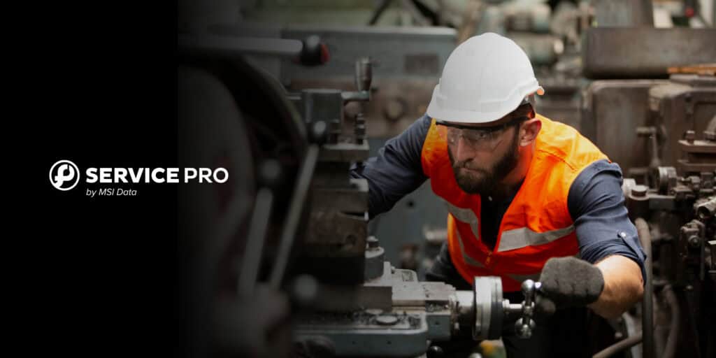 A technician in a hard hat and safety vest servicing industrial machinery on a manufacturing floor, with the Service Pro by MSI Data logo.