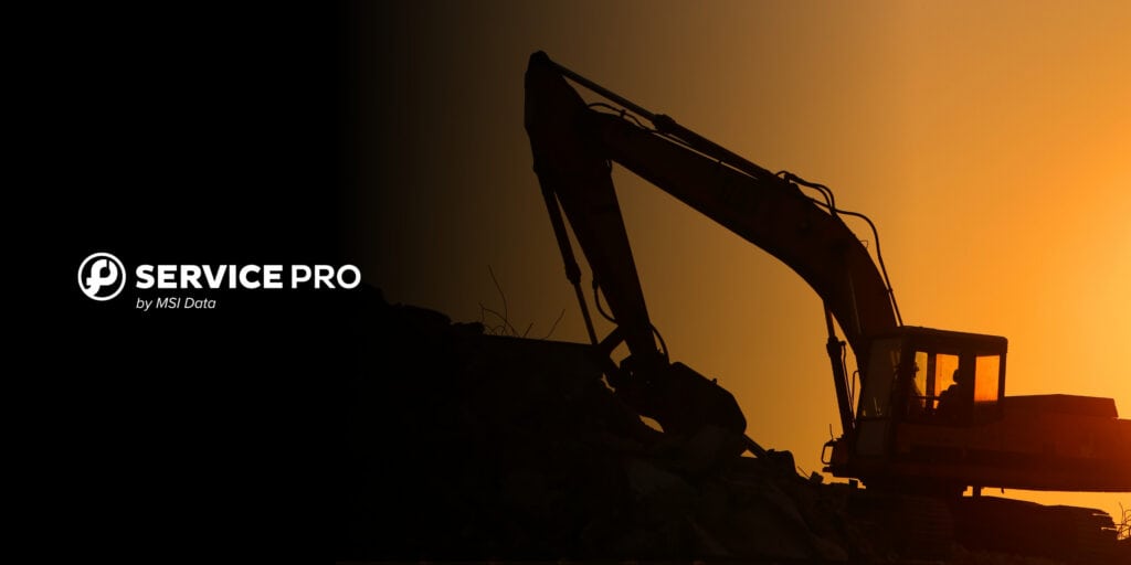 An excavator operator working atop a debris pile at sunset, representing field service management software for companies managing large equipment.