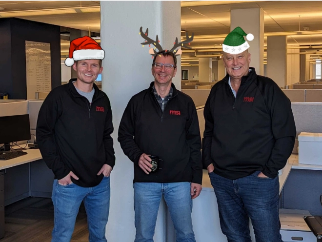 MSI Data employees wearing photoshopped holiday hats.