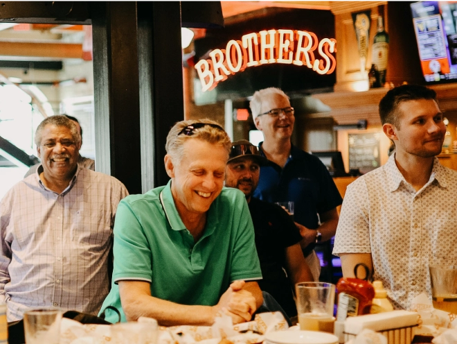 MSI Data employees laughing at a restaurant.