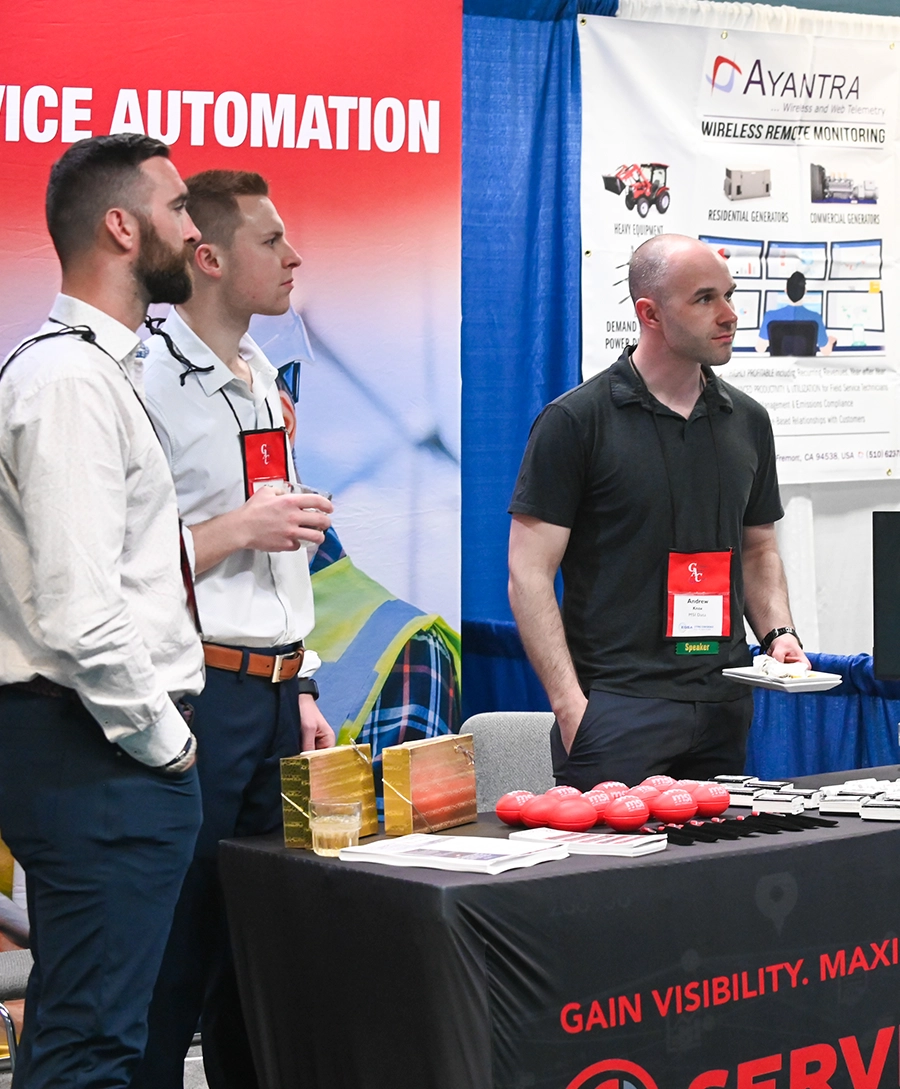 Photo of three MSI Data employees at their trade show booth.