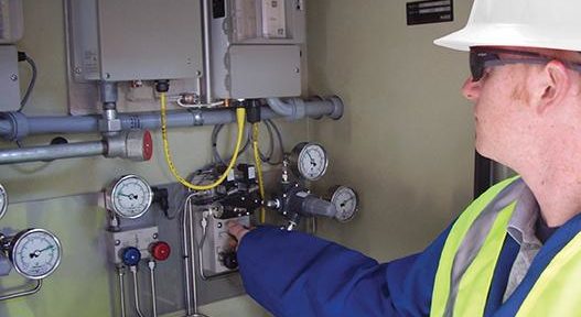 Service technician testing natural gas equipment