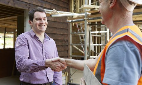 Distributor service technician shaking hands with customer